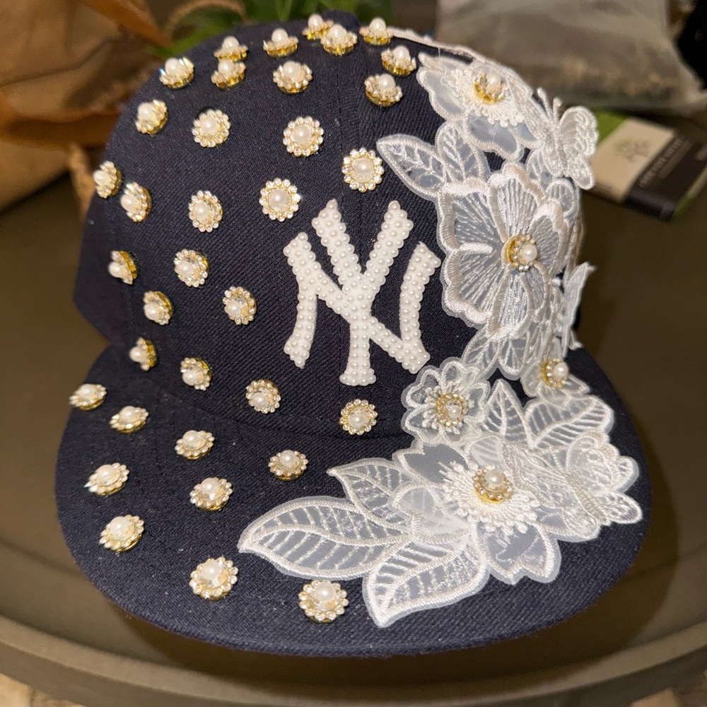 Embellished Navy Cap with Floral and Pearl Accents